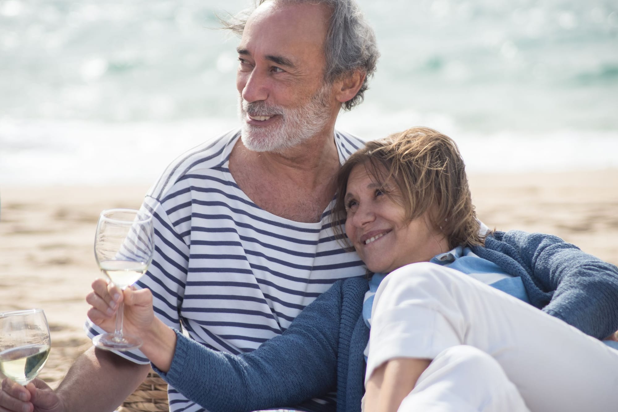A retired couple relaxing by the sea in Portugal
