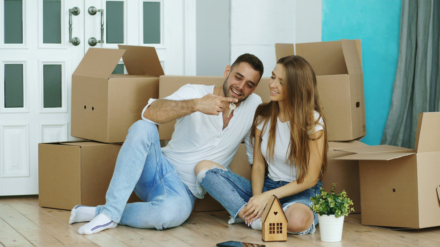 A couple unpacking boxes in their new home